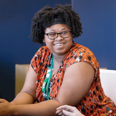 Black female college student smiling.